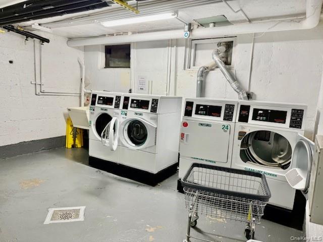 1 Terrace Circle, Unit 3H Great Neck, NY 11021 - Photo 9 of 11 a utility room with dryer and washer