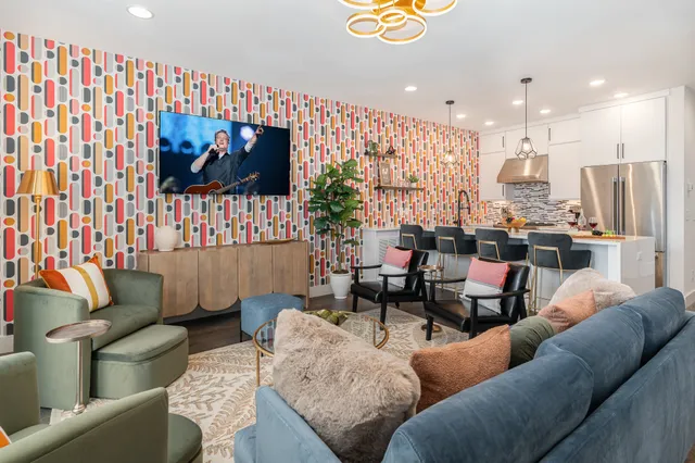 a living room with furniture and a flat screen tv