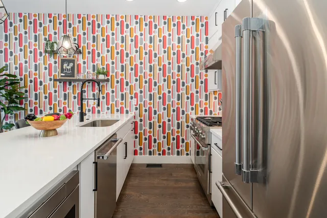 a kitchen with a sink and washing machine