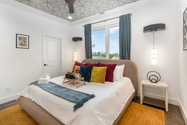 a bedroom with bed and a window