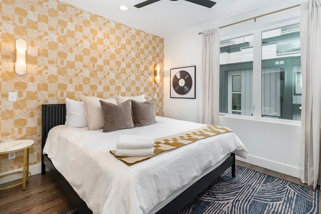 a bedroom with a bed and a window