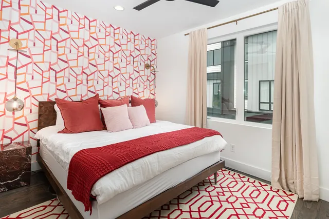 a bedroom with a bed and a window