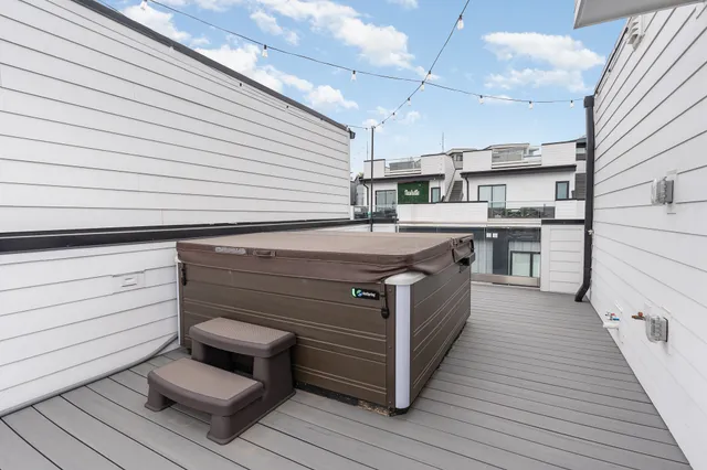 a kitchen with a sink and wooden floor