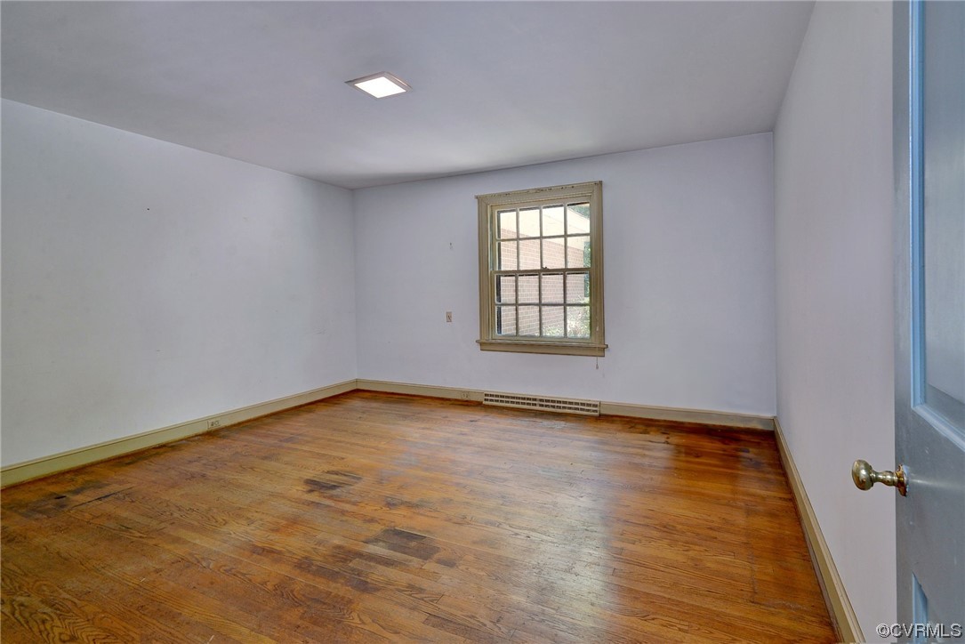 102 Lake Drive Williamsburg, VA 23185 - Photo 14 of 25 wooden floor in an empty room with a window