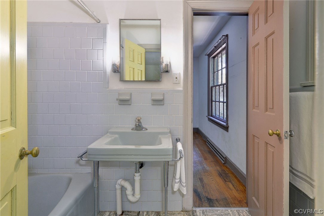 102 Lake Drive Williamsburg, VA 23185 - Photo 19 of 25 a bathroom with a sink and a mirror