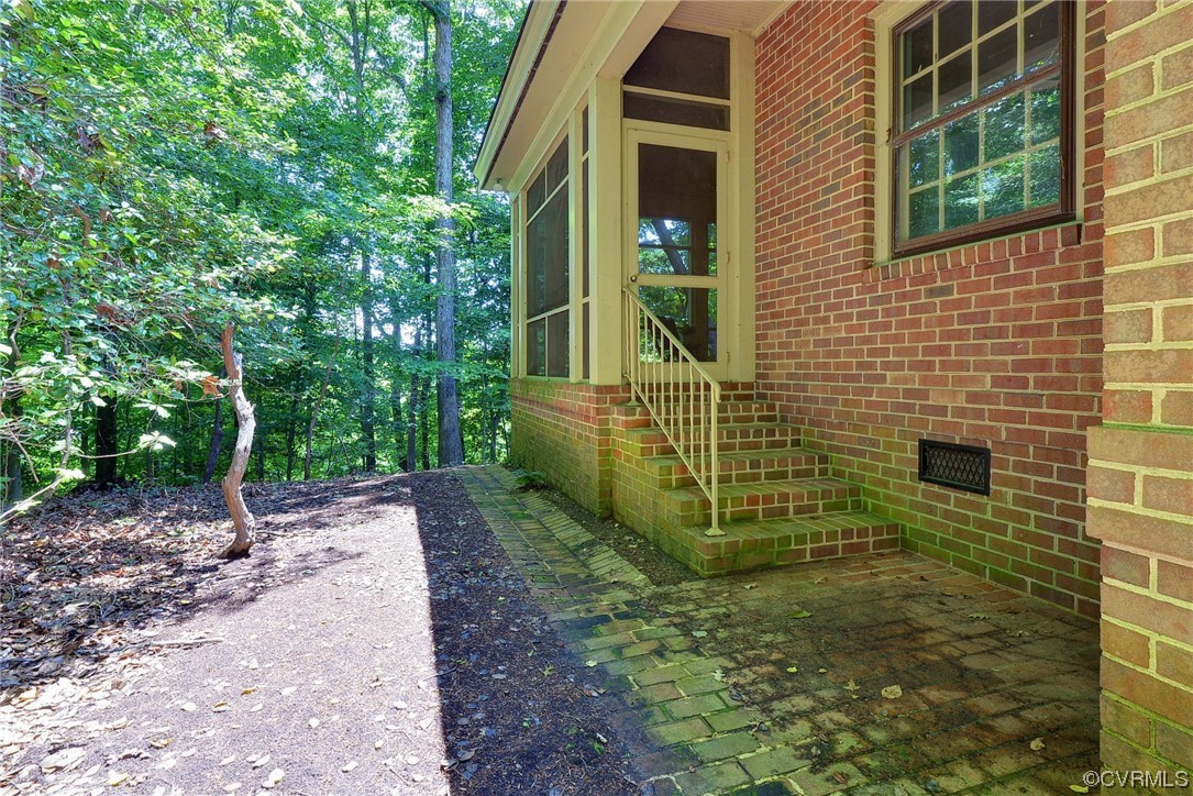 102 Lake Drive Williamsburg, VA 23185 - Photo 22 of 25 a view of a pathway both side of house