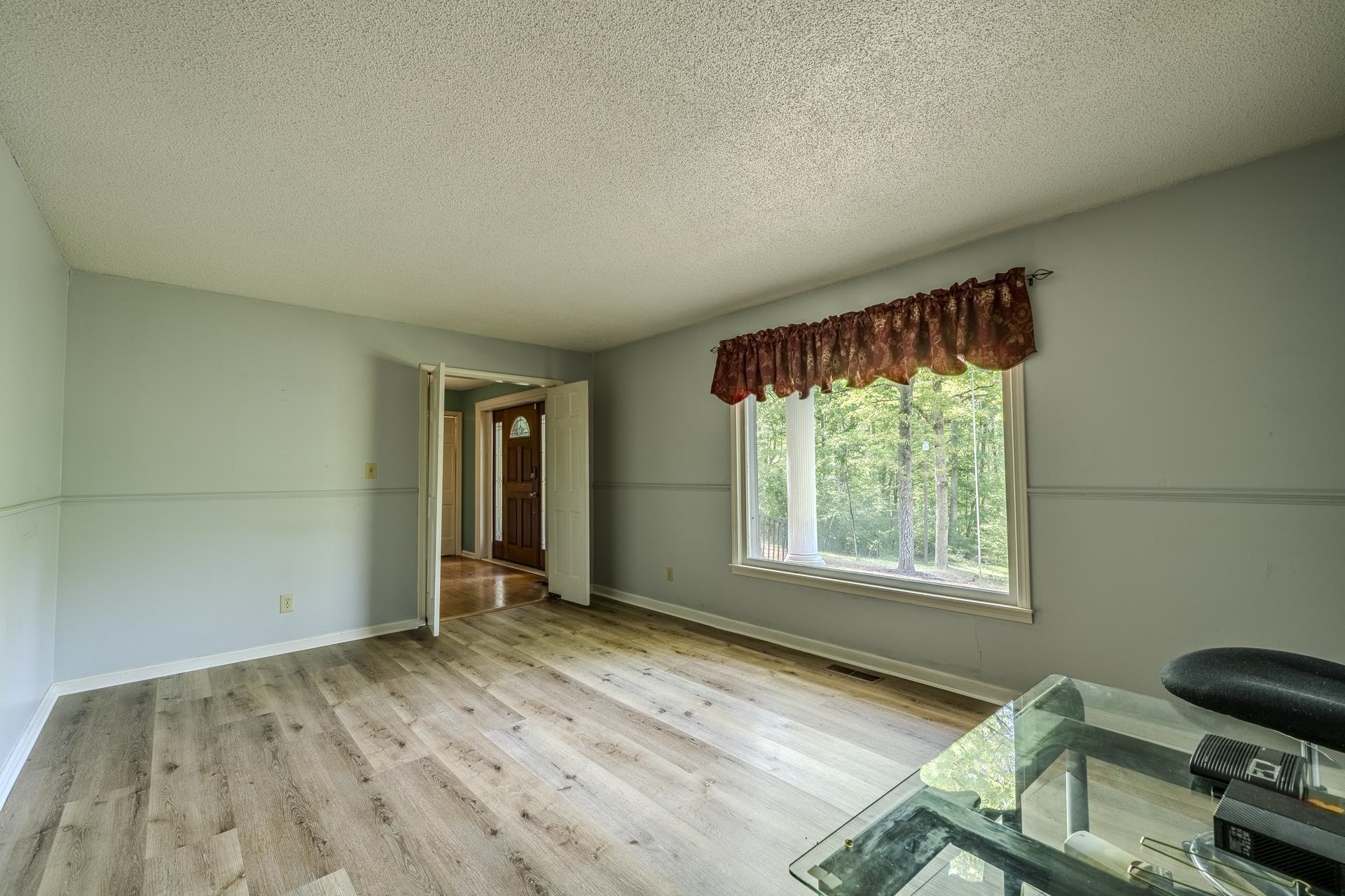 101 Bob Street Selmer, TN 38375 - Photo 12 of 40 a view of an empty room and window