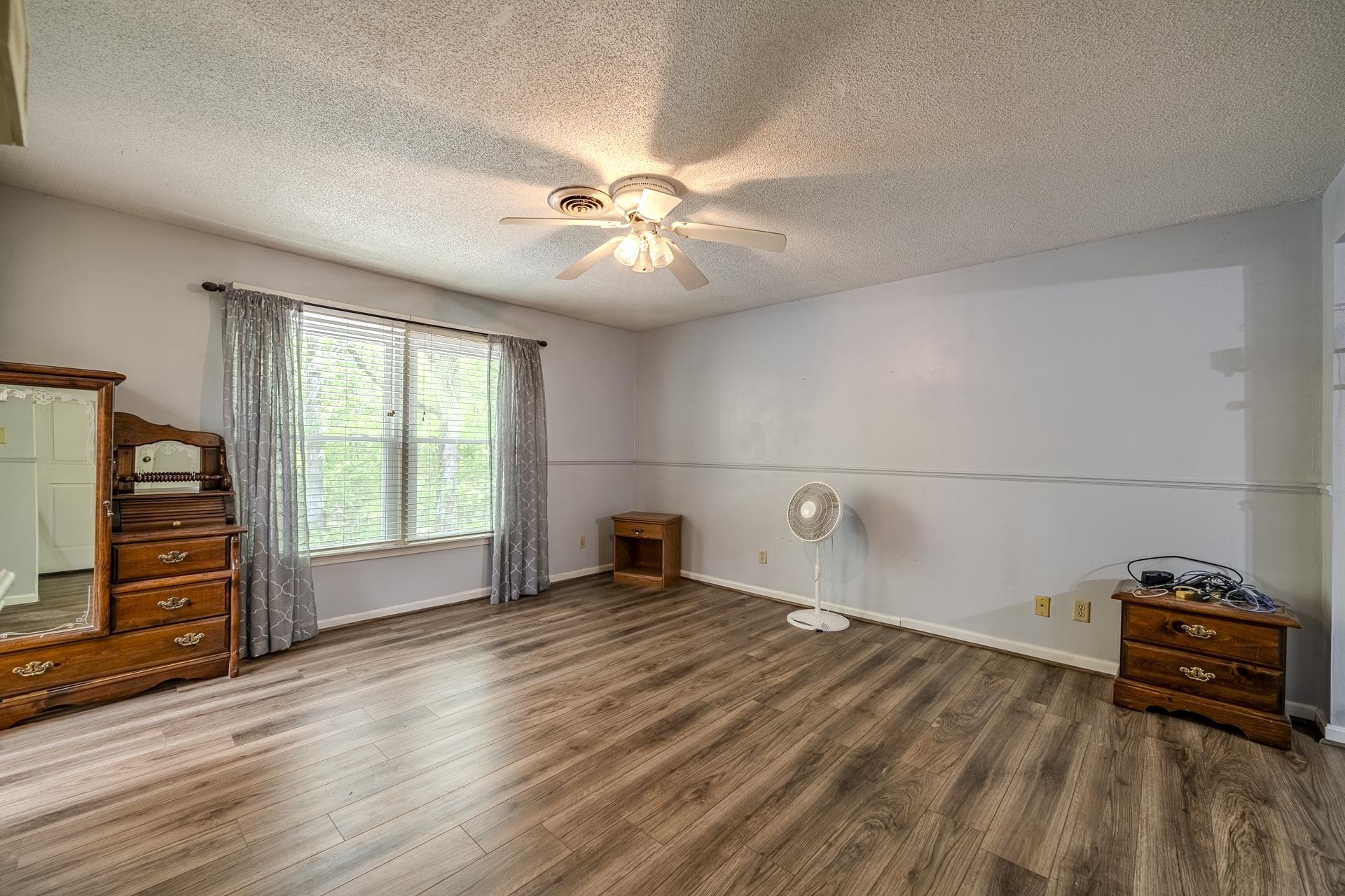 101 Bob Street Selmer, TN 38375 - Photo 17 of 40 a view of a livingroom with wooden floor