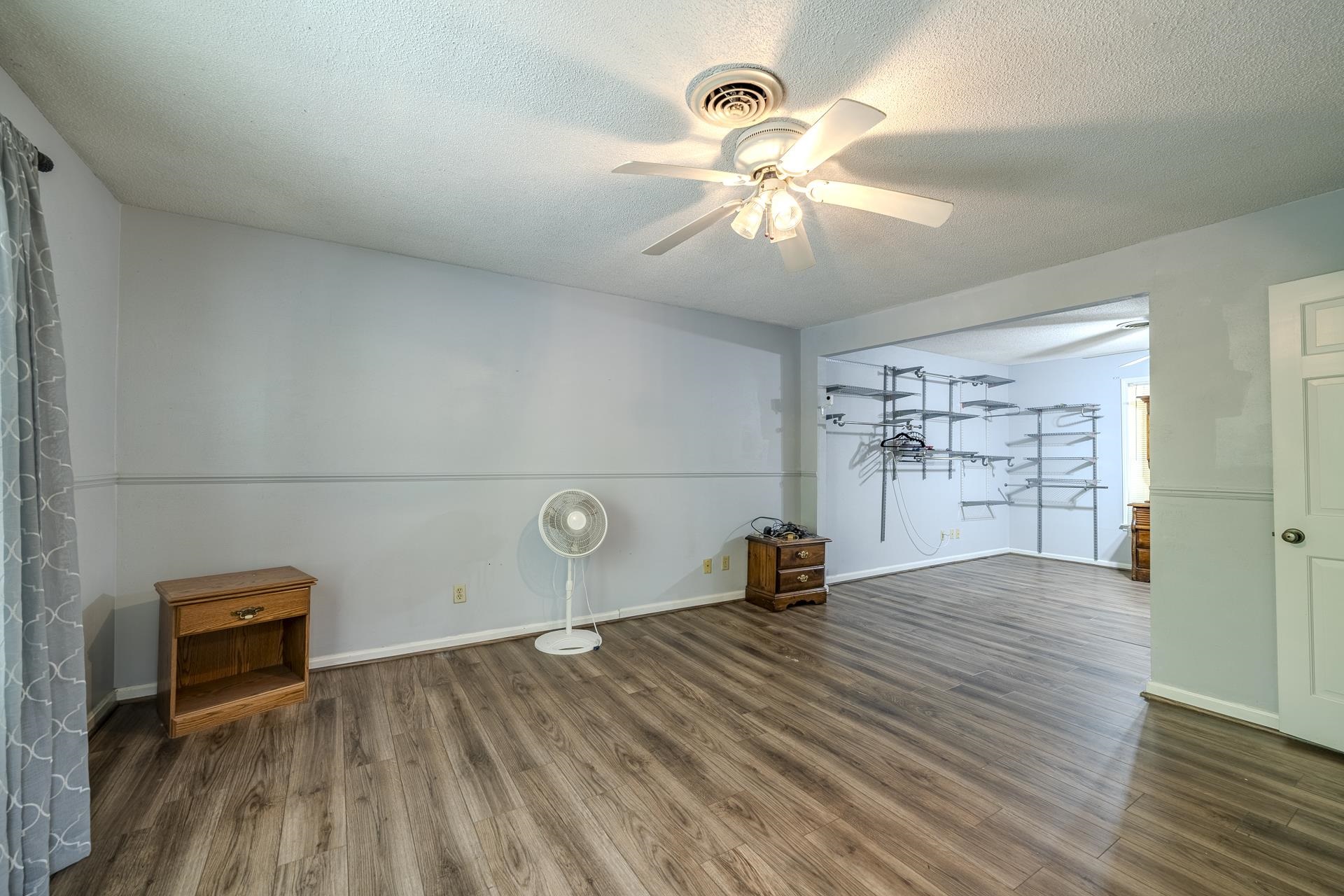101 Bob Street Selmer, TN 38375 - Photo 19 of 40 a view of empty room with wooden floor