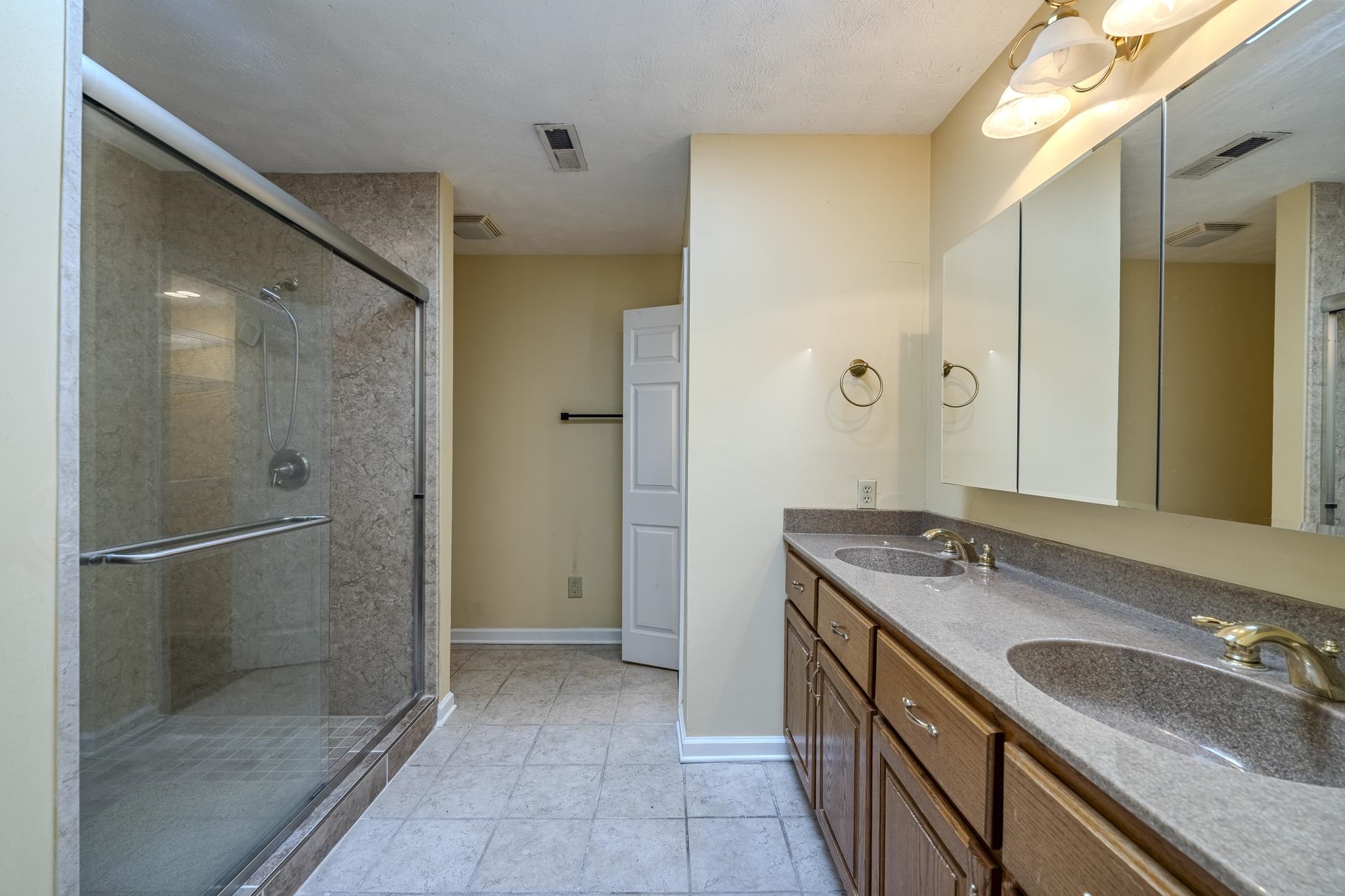 101 Bob Street Selmer, TN 38375 - Photo 21 of 40 a bathroom with a granite countertop shower sink and mirror