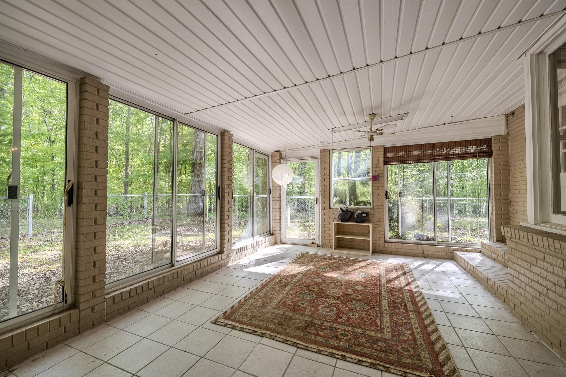 101 Bob Street Selmer, TN 38375 - Photo 31 of 40 a bed sitting in a spacious bedroom next to a large window