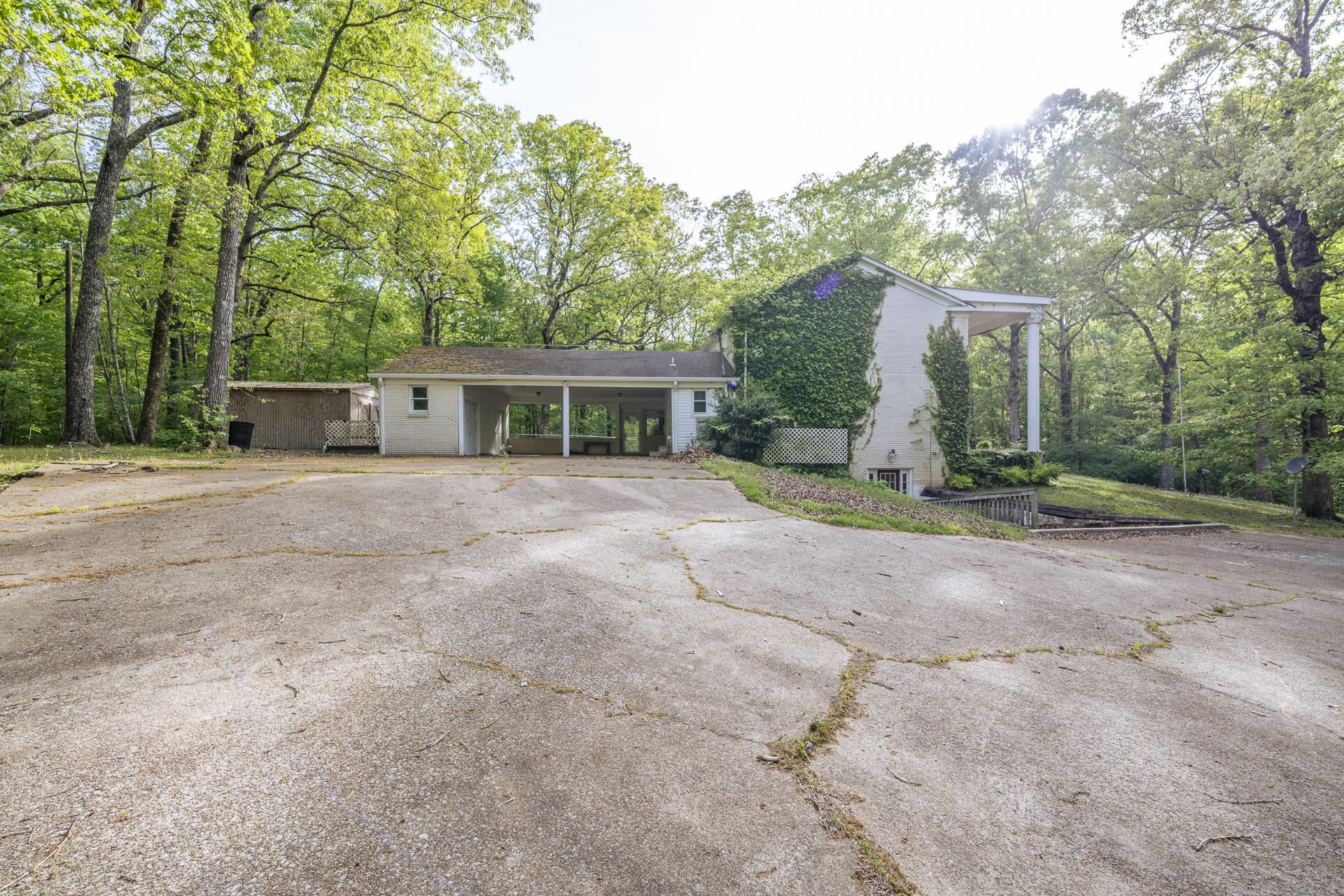 101 Bob Street Selmer, TN 38375 - Photo 35 of 40 a view of a house with backyard and trees