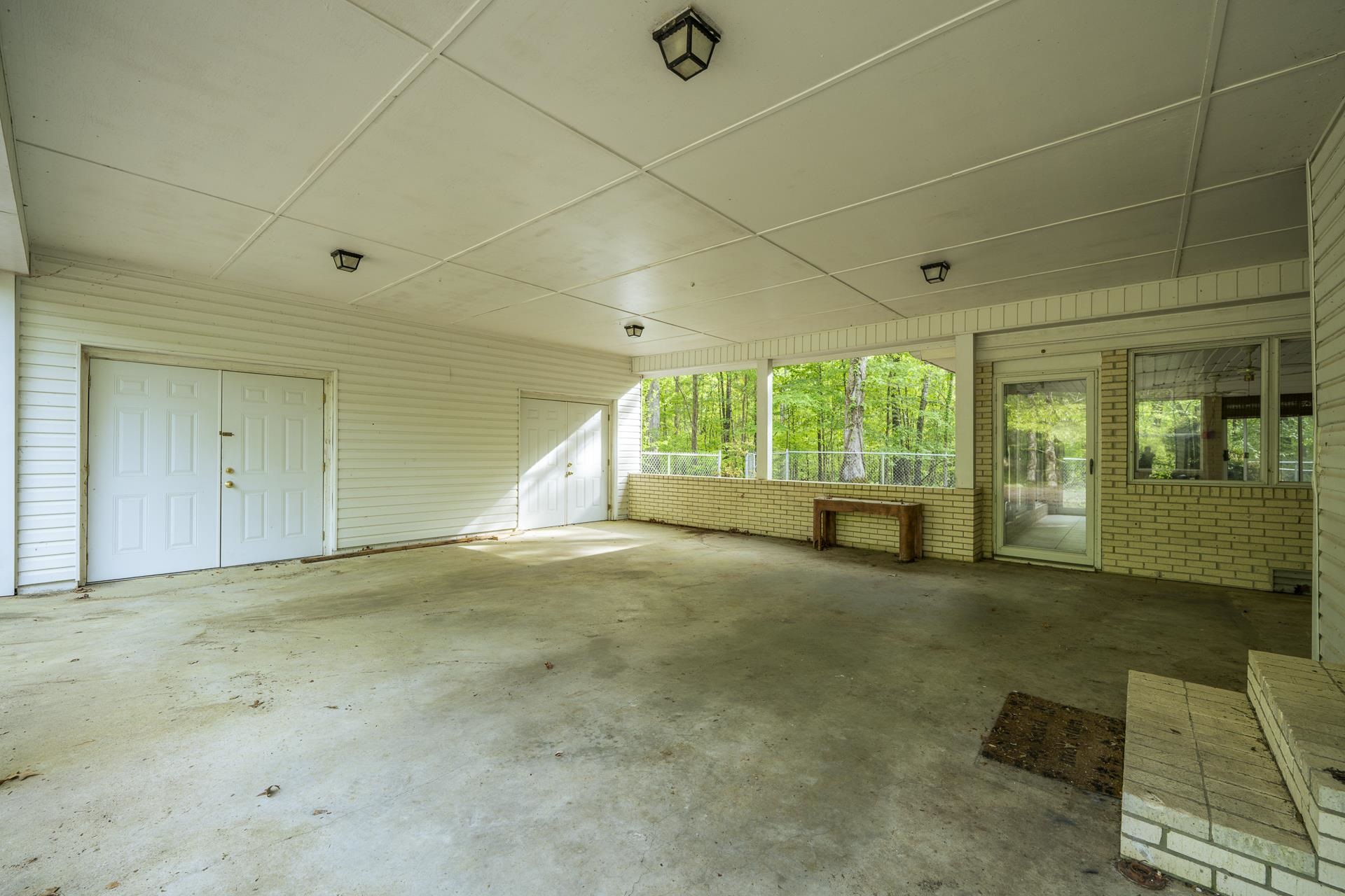 101 Bob Street Selmer, TN 38375 - Photo 38 of 40 a view of an empty room with a fireplace and a window