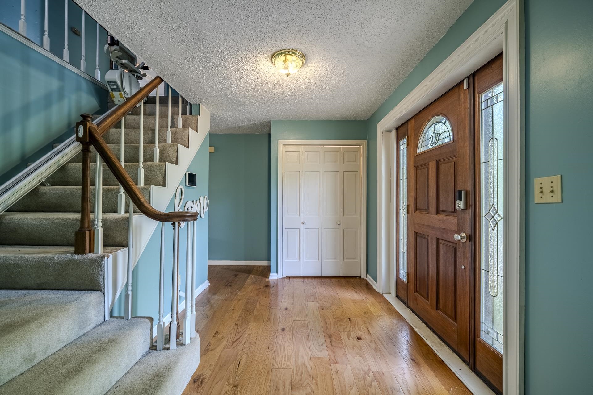 101 Bob Street Selmer, TN 38375 - Photo 4 of 40 a view of entryway with wooden floor and stairs