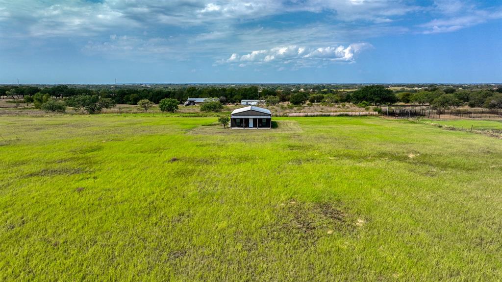 3810 Fairview Road Millsap, TX 76066 - Photo 3 of 25 a swimming pool with lawn chairs