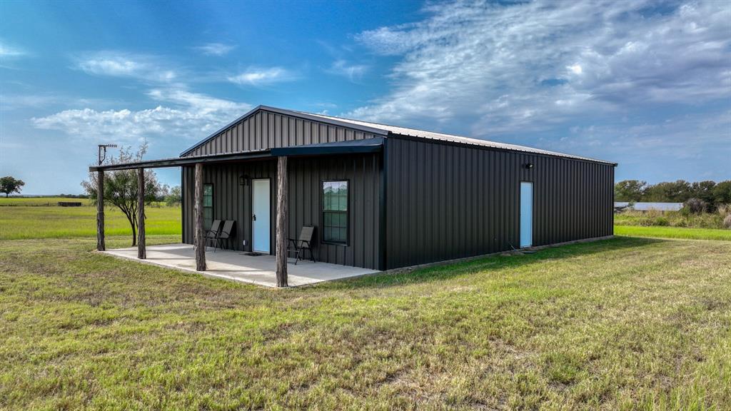 3810 Fairview Road Millsap, TX 76066 - Photo 4 of 25 a backyard of a house with table and chairs