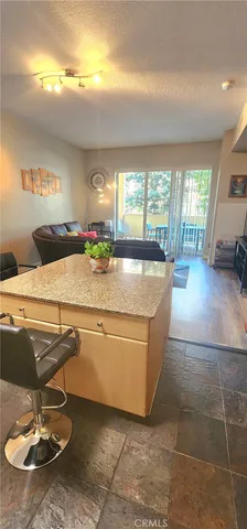 a living room with hard wood flooring and furniture