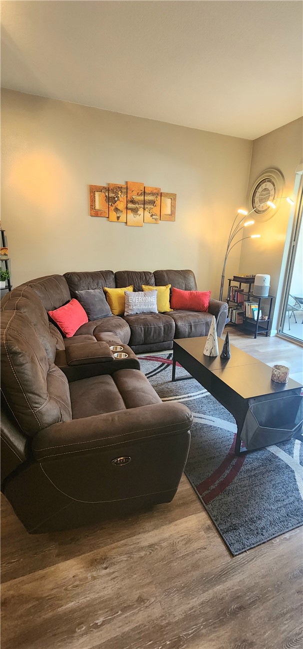 388 East Ocean Boulevard, Unit 206 Long Beach, CA 90802 - Photo 12 of 43 a living room with furniture and a wooden floor