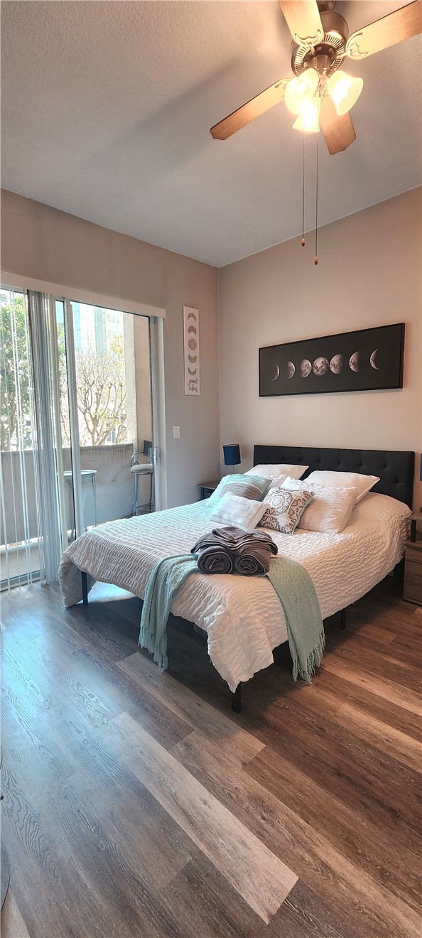 388 East Ocean Boulevard, Unit 206 Long Beach, CA 90802 - Photo 18 of 43 a bedroom with a bed and a ceiling fan