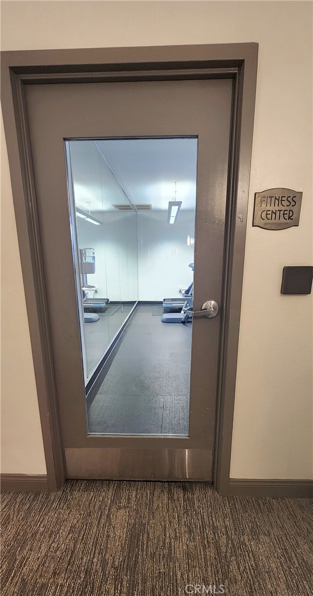 388 East Ocean Boulevard, Unit 206 Long Beach, CA 90802 - Photo 28 of 43 a view of a hallway with wooden floor