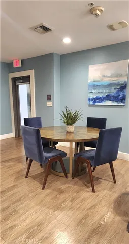 a room with wooden floor table tennis table