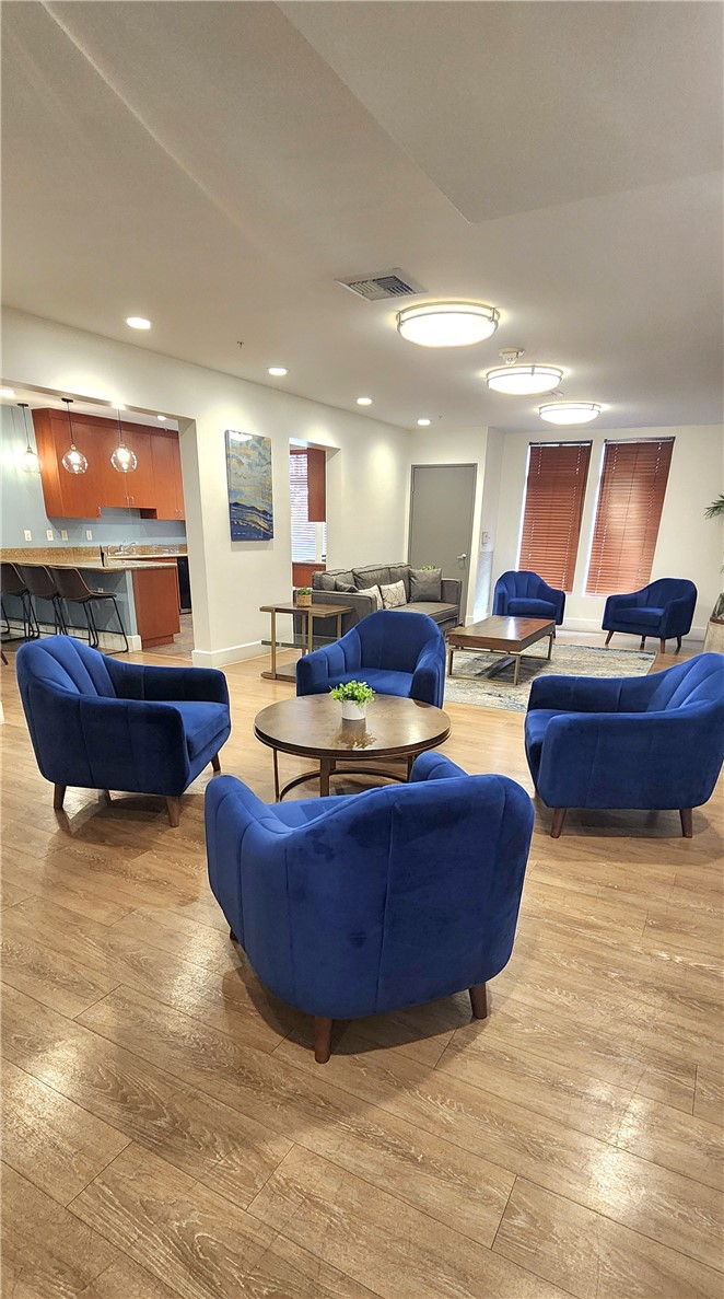 388 East Ocean Boulevard, Unit 206 Long Beach, CA 90802 - Photo 39 of 43 a living room with furniture and a wooden floor