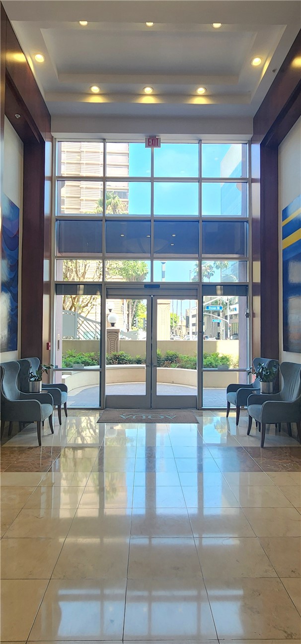 388 East Ocean Boulevard, Unit 206 Long Beach, CA 90802 - Photo 4 of 43 a lobby with furniture and large windows