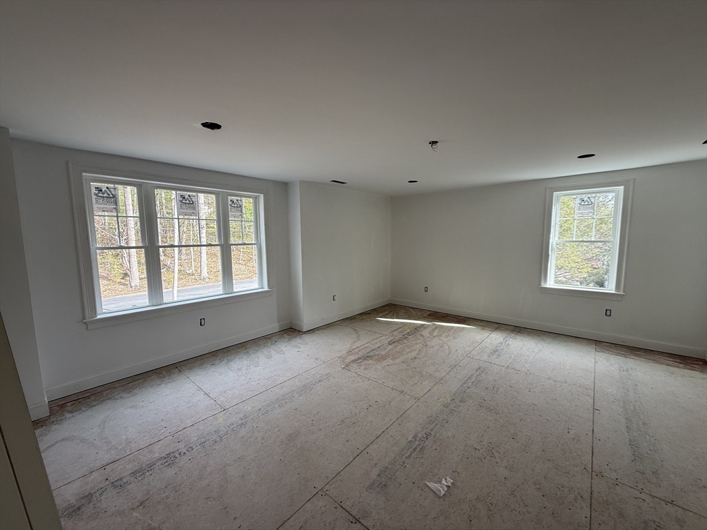 120 Maple Street Stow, MA 01775 - Photo 33 of 36 an empty room with a window