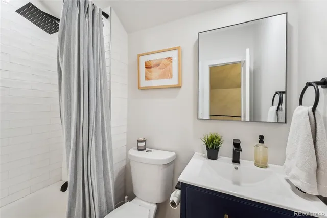 a backyard of a house with barbeque oven table and chairs