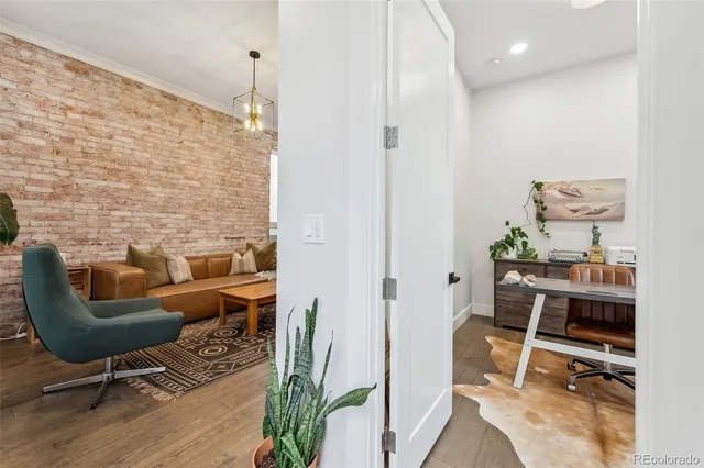 a workspace with furniture and a wooden floor