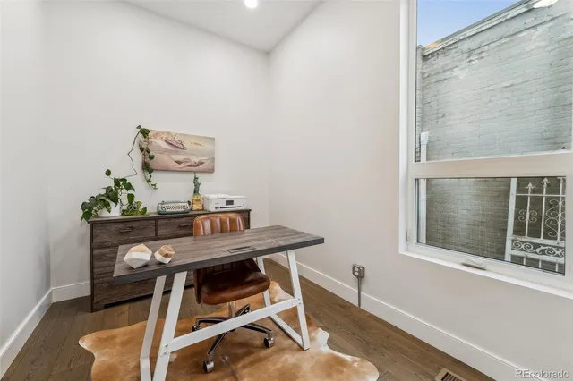 a view of a workspace with furniture