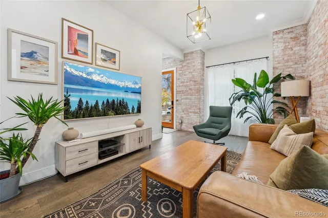 a living room with furniture flowerpot and flower pot