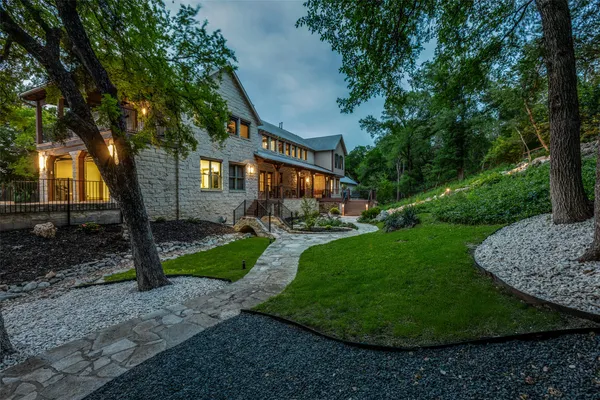 a front view of a house with garden