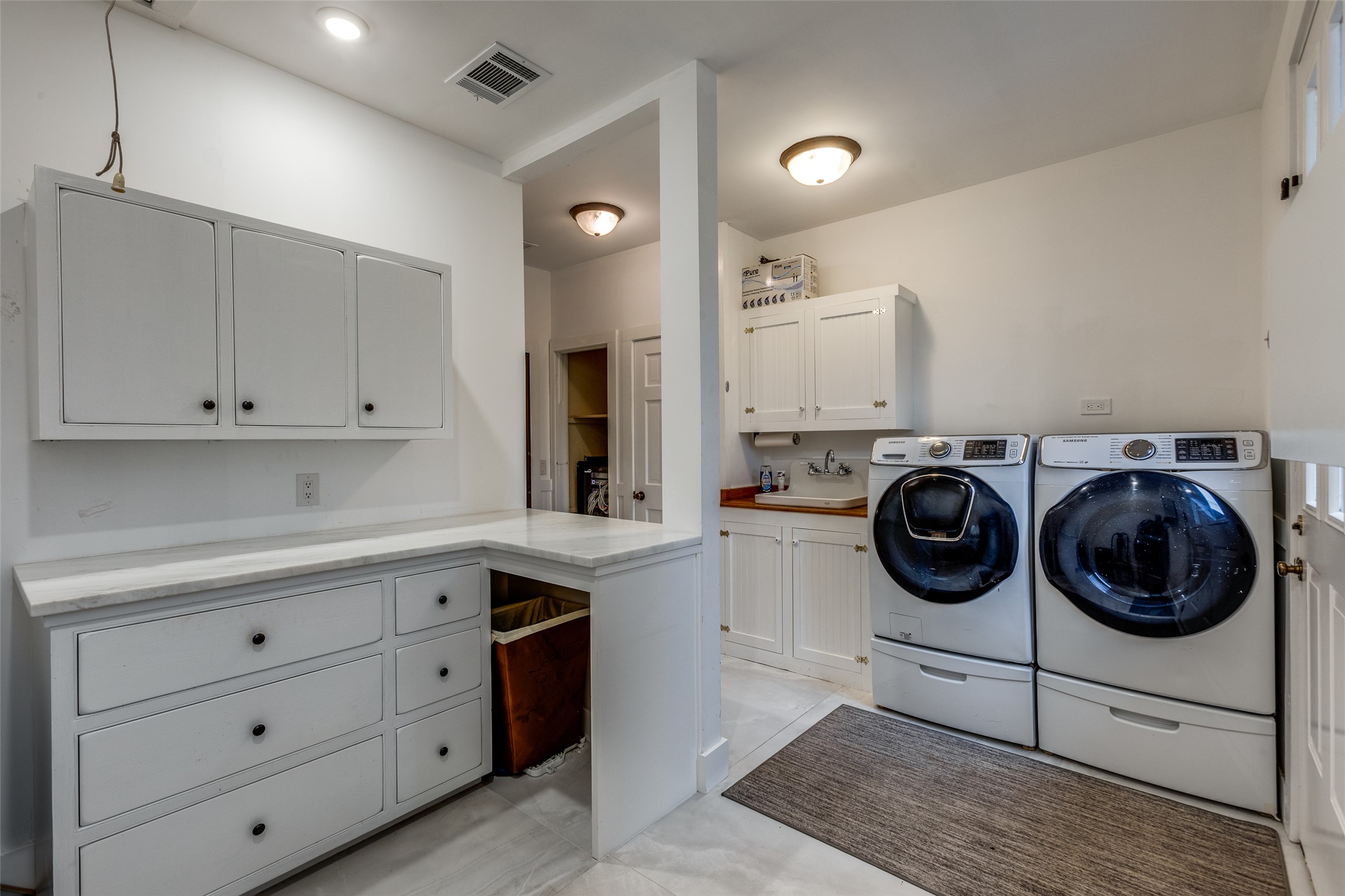 608 Innwood Drive Georgetown, TX 78628 - Photo 22 of 40 Laundry room with plenty of workspace and access to backyard