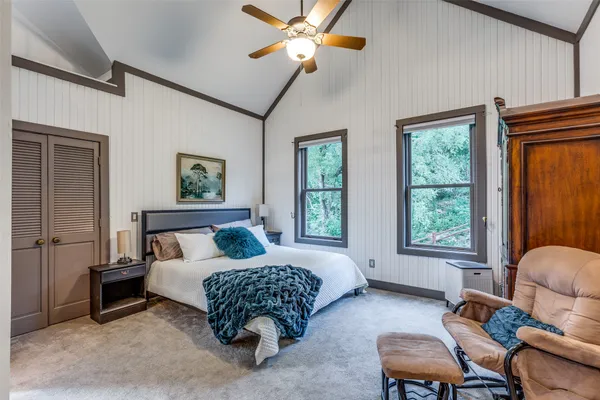 a bedroom with furniture and a window