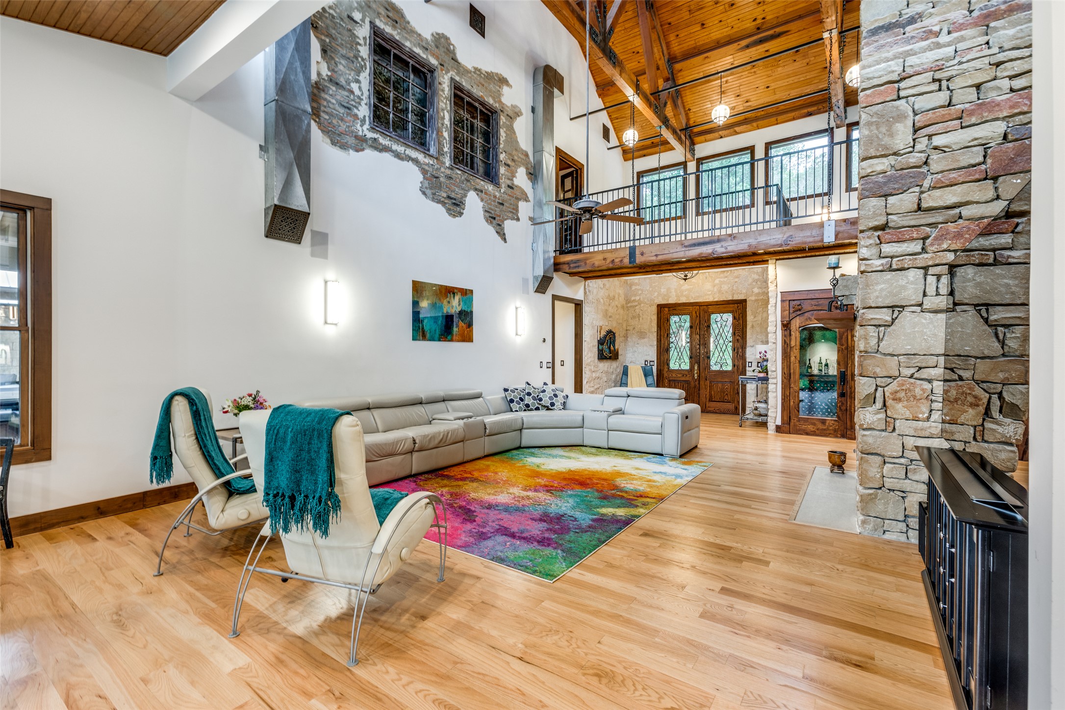608 Innwood Drive Georgetown, TX 78628 - Photo 3 of 40 Living room with soaring 30'ceiling that showcases reclaimed wood beams