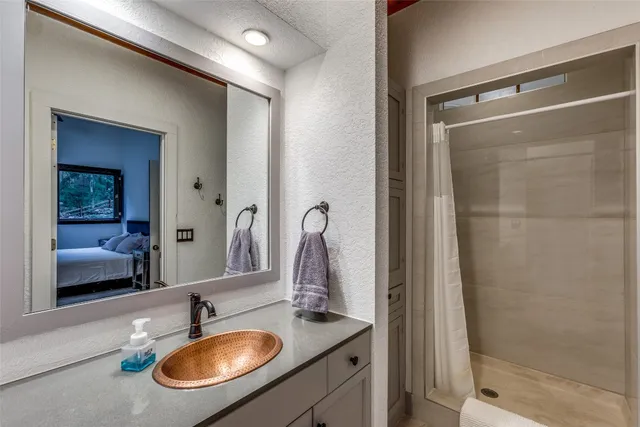 a view of a wooden deck and backyard