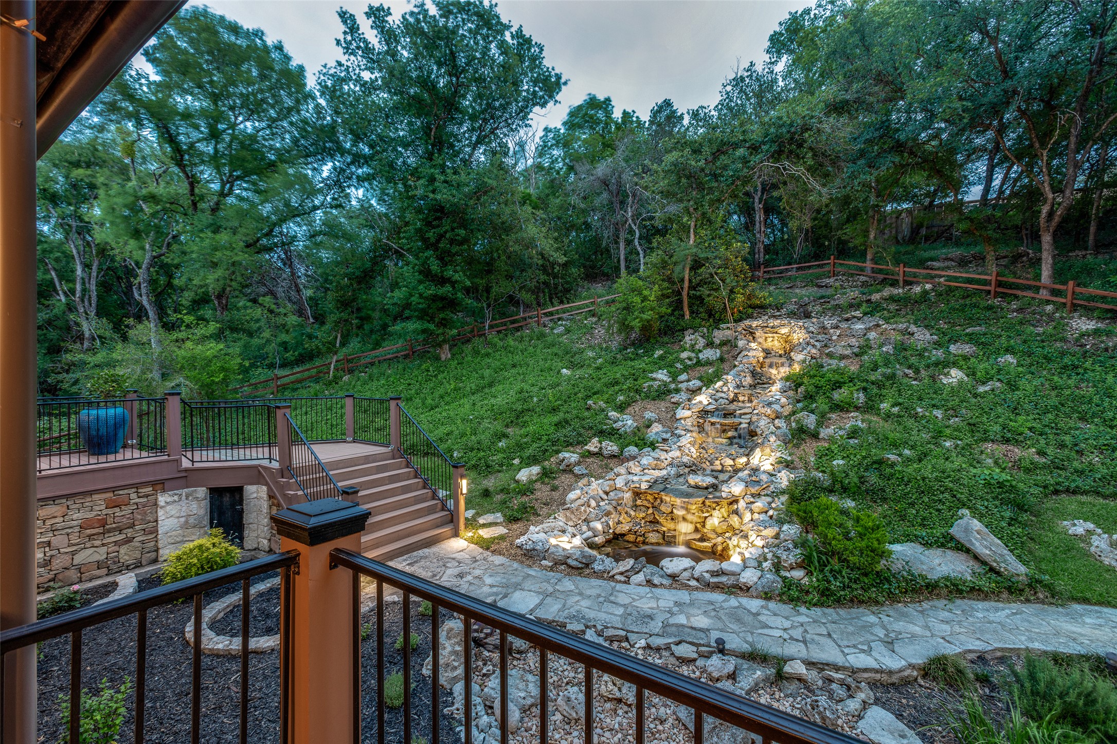 608 Innwood Drive Georgetown, TX 78628 - Photo 37 of 40 40' cascading tranquil waterfall and koi pond