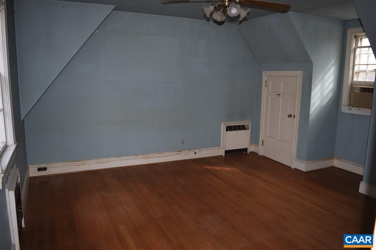 5061 Poindexter Road Louisa, VA 23093 - Photo 28 of 44 a view of an empty room with wooden floor and a window