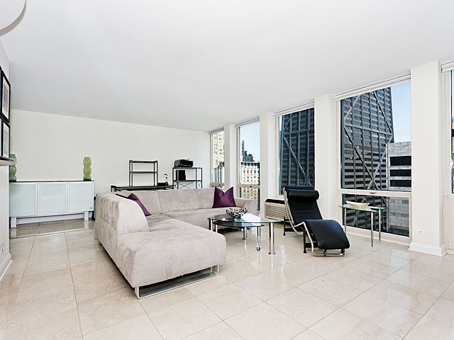 111 East Chestnut Street, Unit 16F Chicago, IL 60611 - Photo 3 of 20 a living room with furniture and a floor to ceiling window