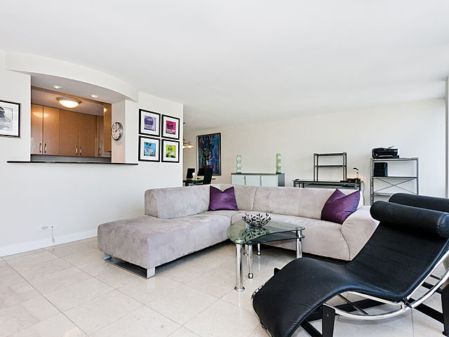 111 East Chestnut Street, Unit 16F Chicago, IL 60611 - Photo 6 of 20 a living room with furniture and a couch