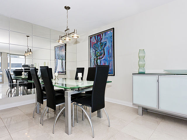 111 East Chestnut Street, Unit 16F Chicago, IL 60611 - Photo 8 of 20 a view of a dining room with furniture