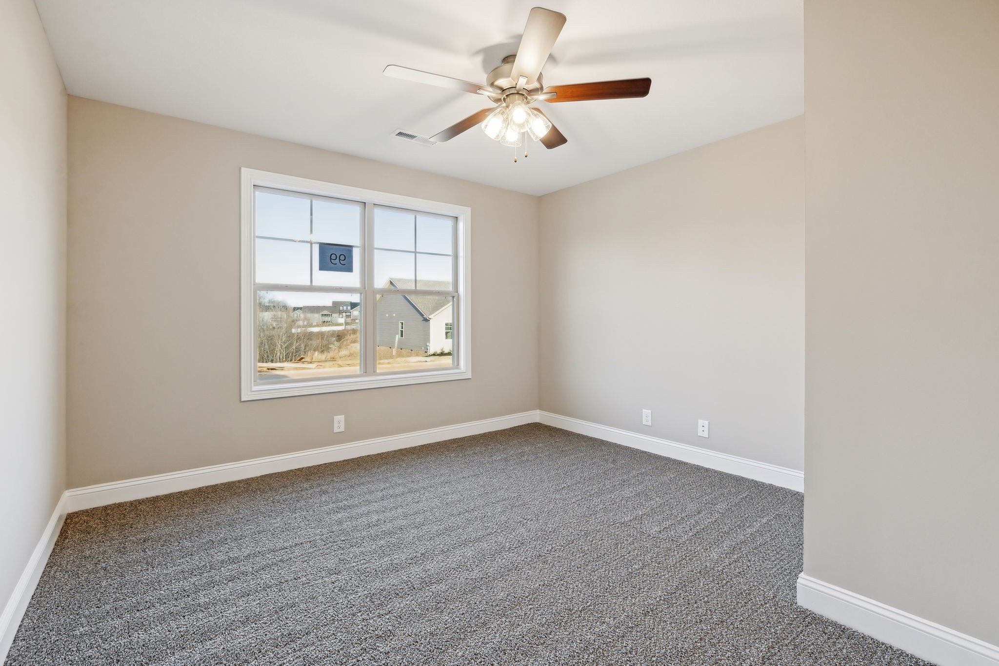 1271 Racker Drive Clarksville, TN 37043 - Photo 25 of 36 an empty room with windows and ceiling fan