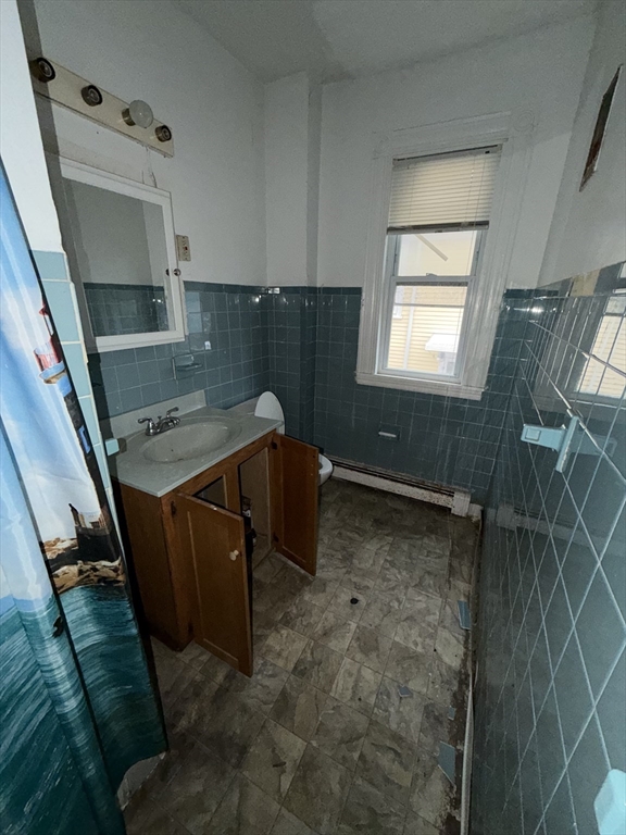 31 Rosedale Street Boston, MA 02124 - Photo 8 of 9 a bathroom with a sink and washing machine