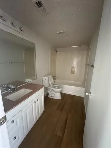 a bathroom with a double vanity sink and mirror