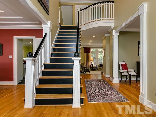 7905 Ogden Court Raleigh, NC 27613 - Photo 3 of 25 a view of entryway and hall with wooden floor