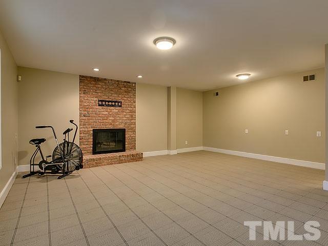 7905 Ogden Court Raleigh, NC 27613 - Photo 23 of 25 a view of a room with a fireplace