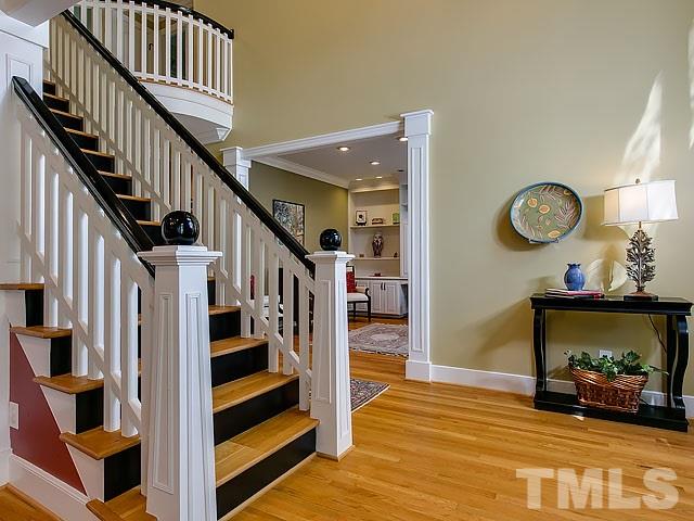 7905 Ogden Court Raleigh, NC 27613 - Photo 4 of 25 a view of entryway and hall with wooden floor
