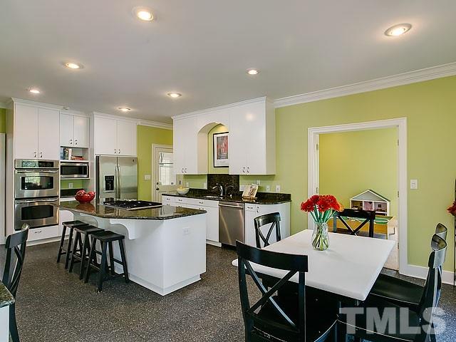 7905 Ogden Court Raleigh, NC 27613 - Photo 7 of 25 a kitchen with a table and chairs in it