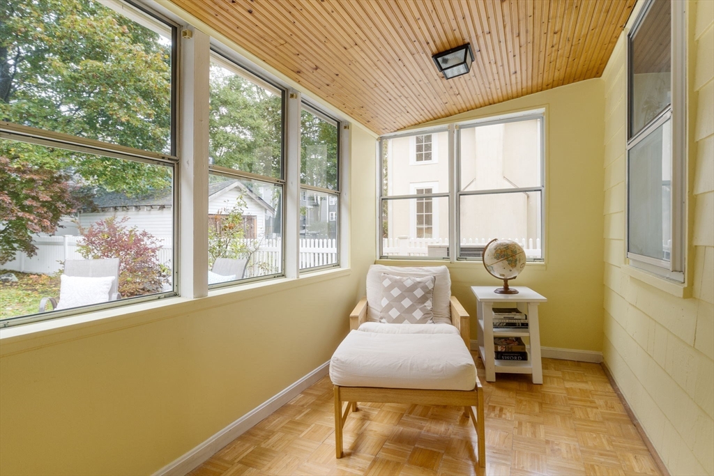 59 Chesbrough Road Boston, MA 02132 - Photo 16 of 27 a living room with furniture and a floor to ceiling window
